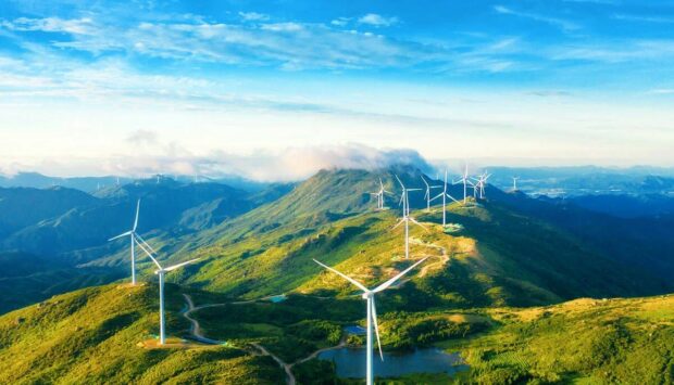 Wind turbines across a mountain range