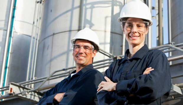 Two workers at industrial plant