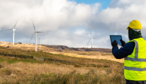 Employee testing wind turbine using device