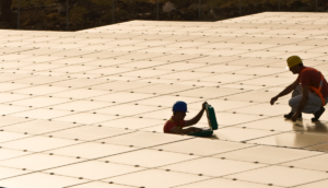 Workers installing solar panels