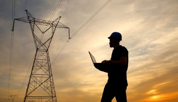 Electrical engineer while working laptop
